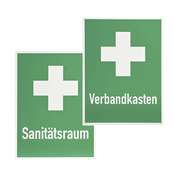 Grünes Schild mit weißem Kreuz und Schrift "Sanitätsraum" für Erste-Hilfe-Raum.  
 Grünes Schild mit weißem Kreuz und Schrift "Verbandkasten" für Erste-Hilfe-Kasten.