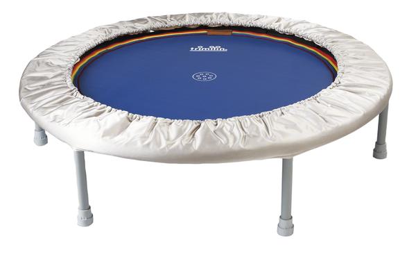 Kleines Fitness-Trampolin mit blauem Sprungtuch und weißem Rand für Indoor-Training.