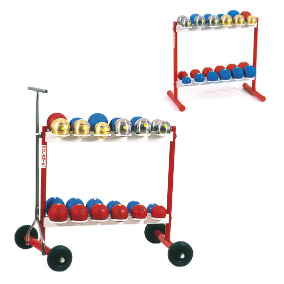 Roter Wagen mit bunten Stoßkugeln in Blau, Rot, Silber und Gold auf zwei Ablagen.