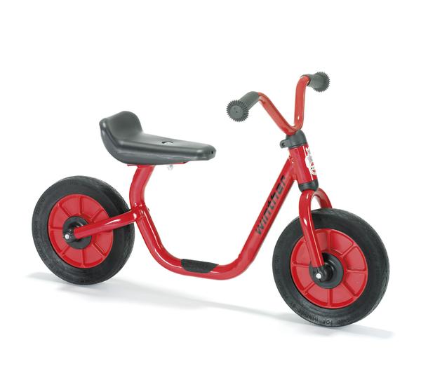 Laufrad für Kinder in Rot mit schwarzem Sitz und griffigen Lenkergriffen, ohne Pedale.