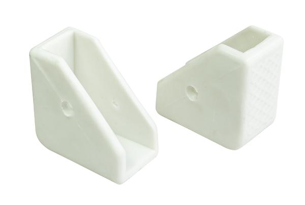 Zwei weiße Gummiecken für Möbel oder Regale, isoliert auf weißem Hintergrund.