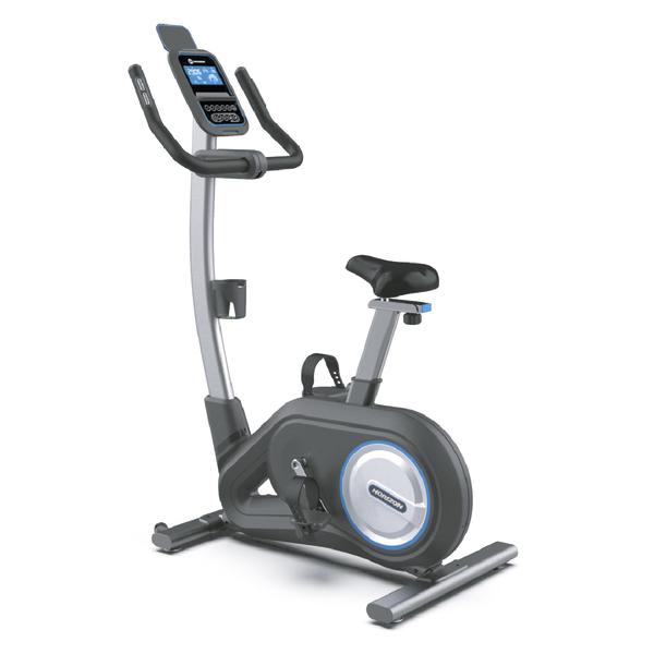 Schwarz-graues Horizon Fitness Ergometer mit blauem Akzentring, verstellbarem Sattel, Trainingscomputer und integrierter Tablet-Halterung in schräger Seitenansicht.