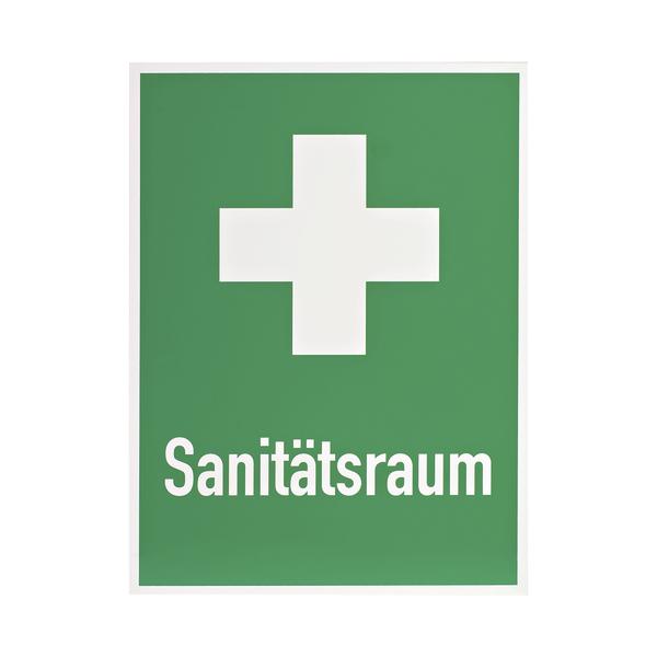 Grünes Schild mit weißem Kreuz und Schrift "Sanitätsraum" für Erste-Hilfe-Raum.