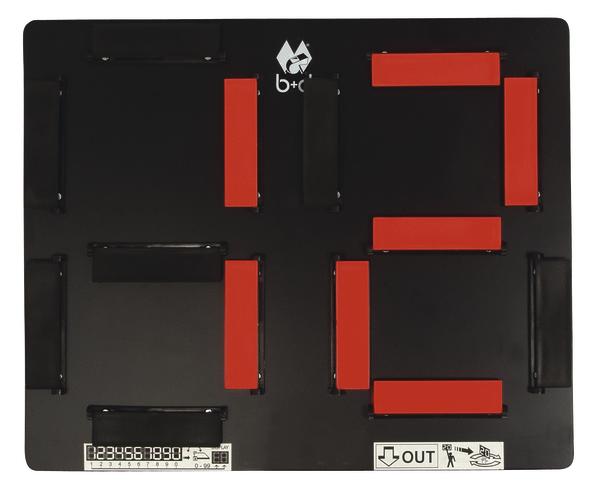 Schwarzes Magnetspiel mit roten und schwarzen rechteckigen Magneten auf Spielfeld.