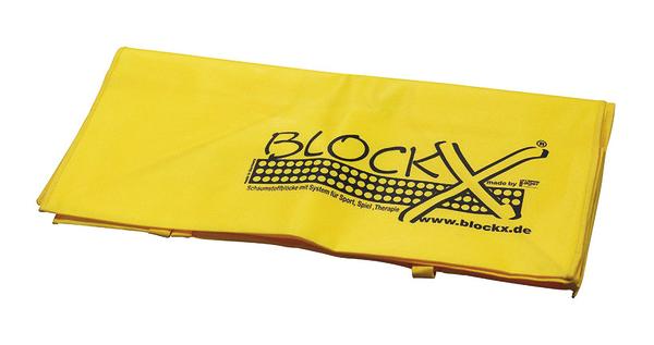 Gelbes BlockX Schutzmatten-System für Sport, Spiel und Therapie, zusammengefaltet.