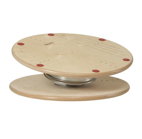 Balancierbrett aus Holz mit runder Form und Metallfeder für Gleichgewichtstraining.