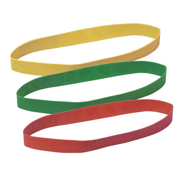 Gummibänder in Gelb, Grün und Rot, flach liegend auf weißem Hintergrund.