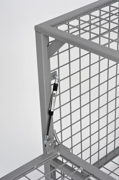 Metallgitterbox mit Gasdruckdämpfer zur sicheren Klappfunktion, graue Stahlkonstruktion.