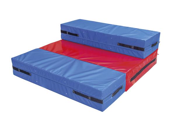 Mehrteilige Gymnastikmatte in Blau und Rot, klappbar und mit Tragegriffen für Sport und Training.