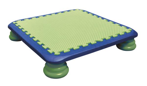 Bunter Balance-Board mit grünem Schaumstoff und blauer Umrandung auf vier runden Füßen.