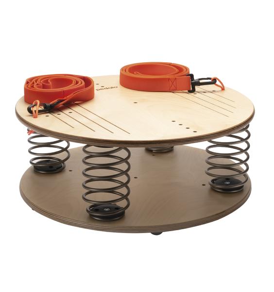 Runde Holzplattform mit Federn und zwei orangen Gurten für Balance- und Stabilitätstraining.